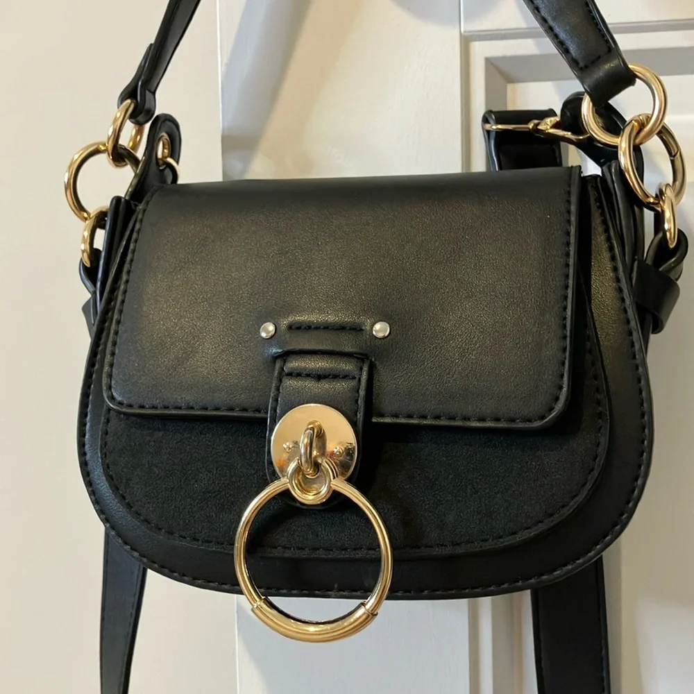 Black Saddle Crossbody Bag with Gold Ring Accent - Picture 1 of 7